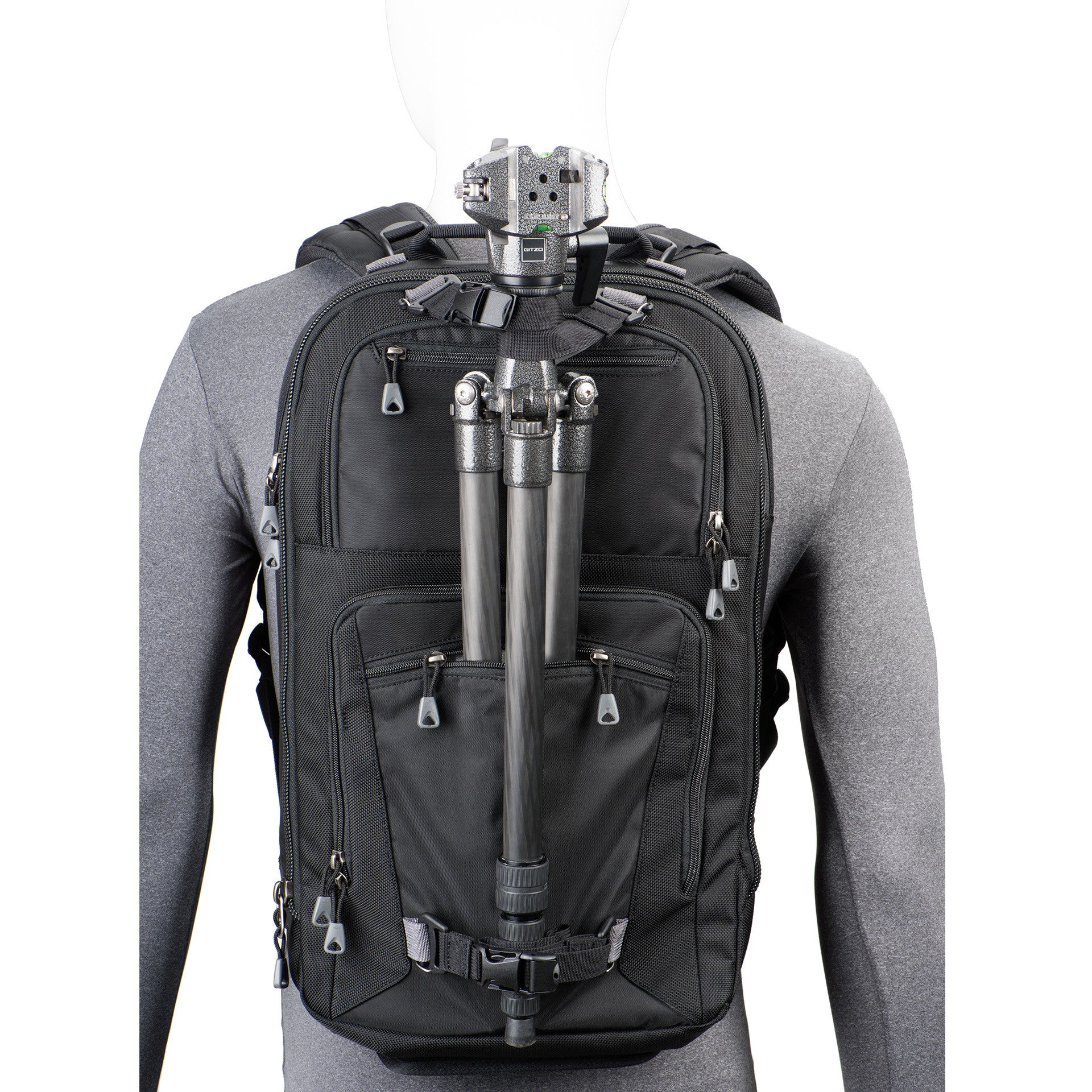 Tripod carry on front of bag keeps weight centered and allows you to access gear without detaching the tripod