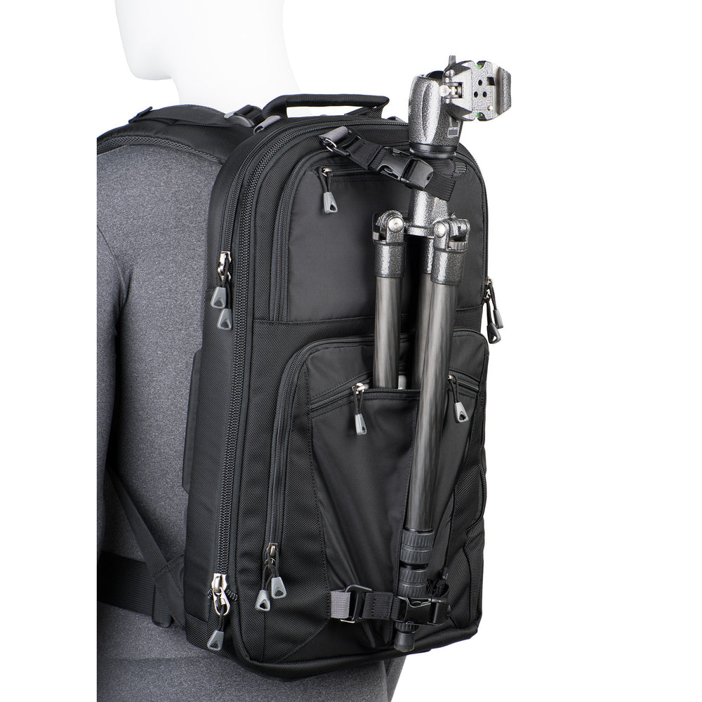 
                  
                    Tripod carry on front of bag keeps weight centered and allows you to access gear without detaching the tripod
                  
                