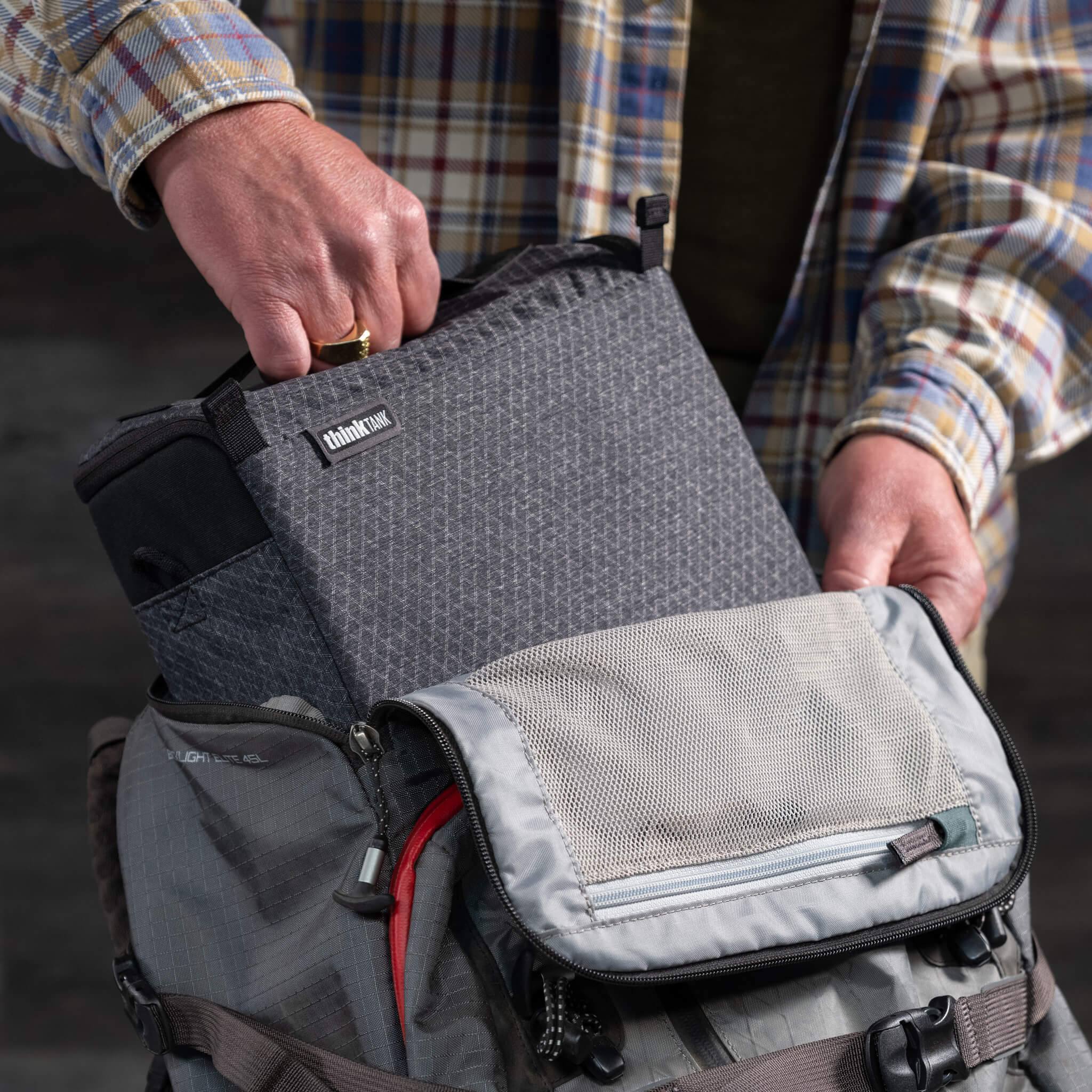 Grab handle makes it easy to pull camera cube from a bag or backpack