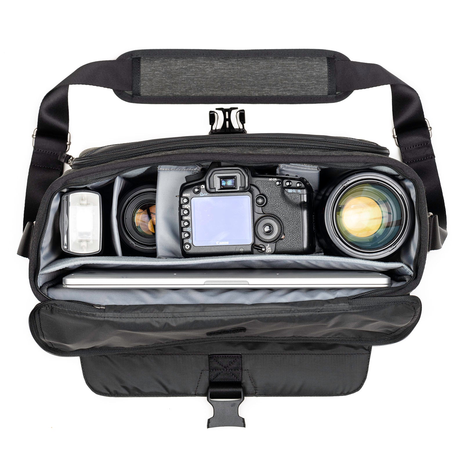 Fits one standard size body with a 24–70mm f/2.8 attached, 2–4 extra lenses, flash, a 10” tablet and a 15” laptop. Accommodates a 70–200mm f/2.8 detached.