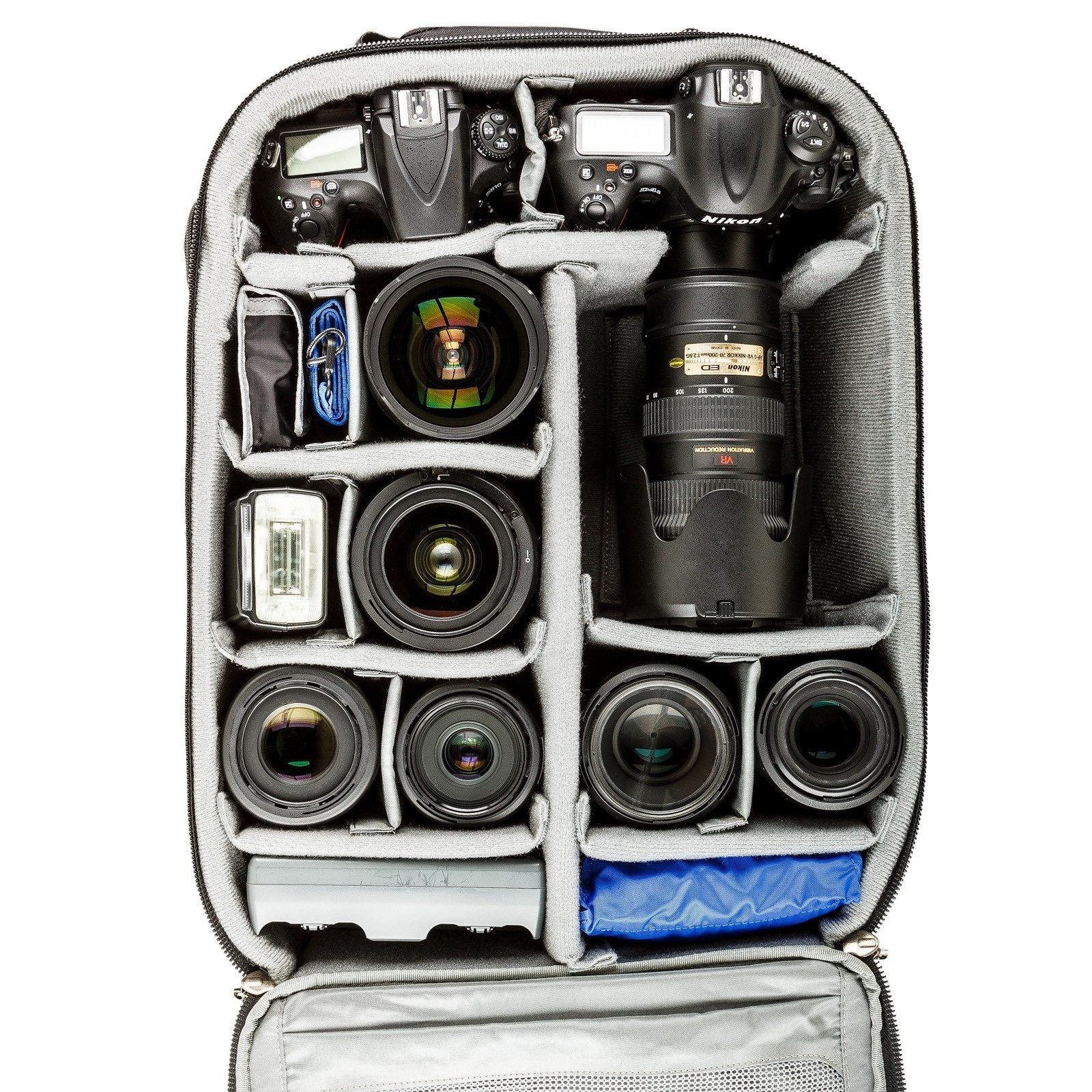 Two gripped DSLRs with seven lenses and a flash
